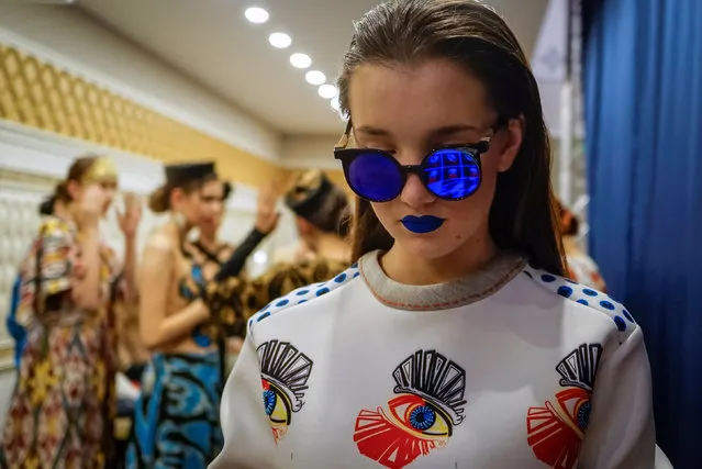 A model waits for a show backstage during Kazakhstan Fashion Week in Almaty, Kazakhstan, April 20, 2016. (Photo by Shamil Zhumatov/Reuters)