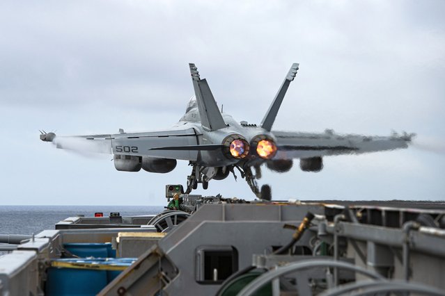 An E/A-18G Growler aircraft launches from the flight deck of the aircraft carrier USS Nimitz in the South China Sea, Sunday, February 12, 2023, as Nimitz in U.S. 7th Fleet was conducting operations. The 7th Fleet based in Japan said Sunday that the USS Nimitz aircraft carrier strike group and the 13th Marine Expeditionary Unit have been conducting “integrated expeditionary strike force operations” in the South China Sea. (Photo by Mass Communication Specialist 3rd Class Joseph Calabrese/U.S. Navy via AP Photo)