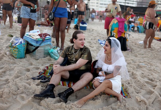 People gather at Copacabana beach to attend Madonna's concert in Rio de Janeiro, Brazil on May 4, 2024. (Photo by Pilar Olivares/Reuters)