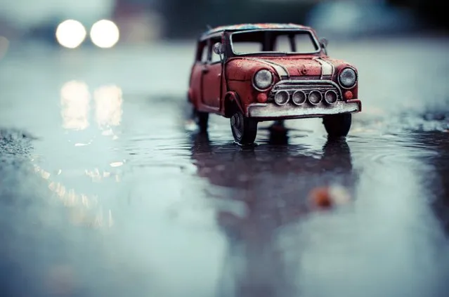 “Driving in the Rain”, Red Union Jack Mini Cooper, Solothurn, Switzerland, November 2012. (Photo by Kim Leuenberger)