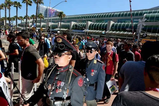 Cosplay enthusiasts walk outside the Convention Center during the 2015 Comic-Con International in San Diego, California July 10, 2015. (Photo by Sandy Huffaker/Reuters)