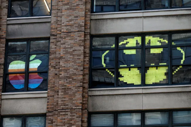 Images created with Post-it notes are seen in the windows of offices at 75 Varick Street in lower Manhattan, New York, U.S., May 18, 2016, where advertising agencies and other companies have started what is being called a “Post-it note art war” with employees creating colorful images in their windows with Post-it notes. (Photo by Mike Segar/Reuters)