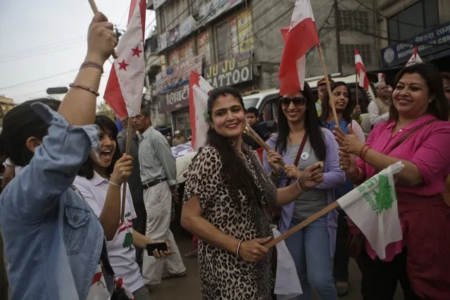 In this May 11, 2017 photo, supporters of Nepali Congress party march during an election campaign event in Bhaktapur, Nepal. Much has changed since Nepal last held local elections 20 years ago – the Himalayan country's 240-year monarchy was abolished, federal democracy was introduced and political wrangling took center stage. Earthquakes ravaged the country. A Maoist insurgency left thousands dead. And widespread poverty ensured daily life for many remained a struggle if not a misery. Through it all, Nepal's 29 million citizens have had only government-appointed bureaucrats to look to for answers or help with settling local disputes. Many voters said they were excited for the chance this weekend to choose local representatives for the first time since 1997. (Photo by Niranjan Shrestha/AP Photo)