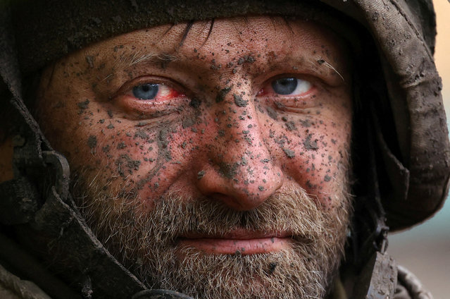 A Ukrainian serviceman looks on as he returns from heavy fighting amid Russia’s attack on Ukraine, close to Bakhmut, Ukraine on April 15, 2023. (Photo by Kai Pfaffenbach/Reuters)