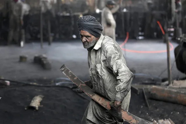 A Pakistani man works at a steel mill on the eve of International Labor Day in Lahore, Pakistan, 30 April 2016. (Photo by Rahat Dar/EPA)