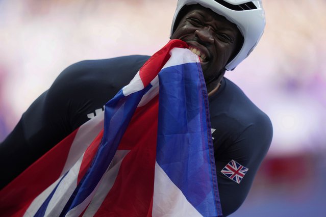 Britain's Marcus Perrineau Daley celebrates after winning the silver medal in the men's 100m T52 final during the 2024 Paralympics, Friday, September 6, 2024, in Paris, France. (Photo by Thibault Camus/AP Photo)