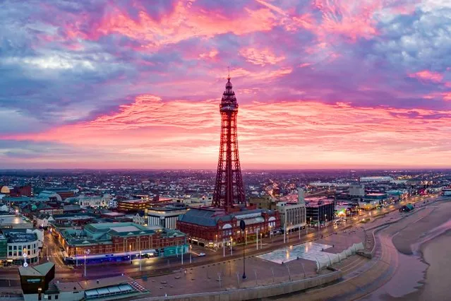 A stunning sunrise over Blackpool, England on December 30, 2019 heralded a mild and largely dry end to the year, though there is a chance of rain farther north. (Photo by Stephen Cheatley/BAV MEDIA)