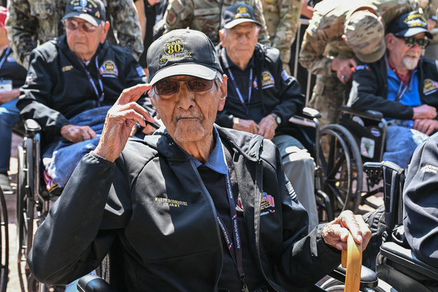 US veteran Marty Rodriguez salutes, ahead of a veterans parade in the town center of Sainte-Mere-Eglise, northwestern France, on June 5, 2024, as part of the “D-Day” commemorations marking the 80th anniversary of the World War II Allied landings in Normandy. The D-Day ceremonies on June 6 this year mark the 80th anniversary since the launch of 'Operation Overlord', a vast military operation by Allied forces in Normandy, which turned the tide of World War II, eventually leading to the liberation of occupied France and the end of the war against Nazi Germany. (Photo by Miguel Medina/AFP Photo)