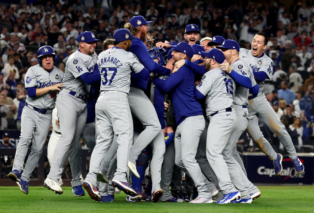 Los Angeles Dodgers players and coaches celebrate after winning the 2024 MLB World Series against the New York Yankees at Yankee Stadium on October 31, 2024. (Photo by Vincent Carchietta/Reuters)