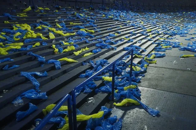 Plastics with the colors of Argentina's Boca Juniors lay on the bleachers after the team lost 5-6 to Brazil's Corinthians in a penalty shootout during a Copa Libertadores round of sixteen soccer match in Buenos Aires, Argentina, Wednesday, July 6, 2022. (Photo by Victor R. Caivano/AP Photo)