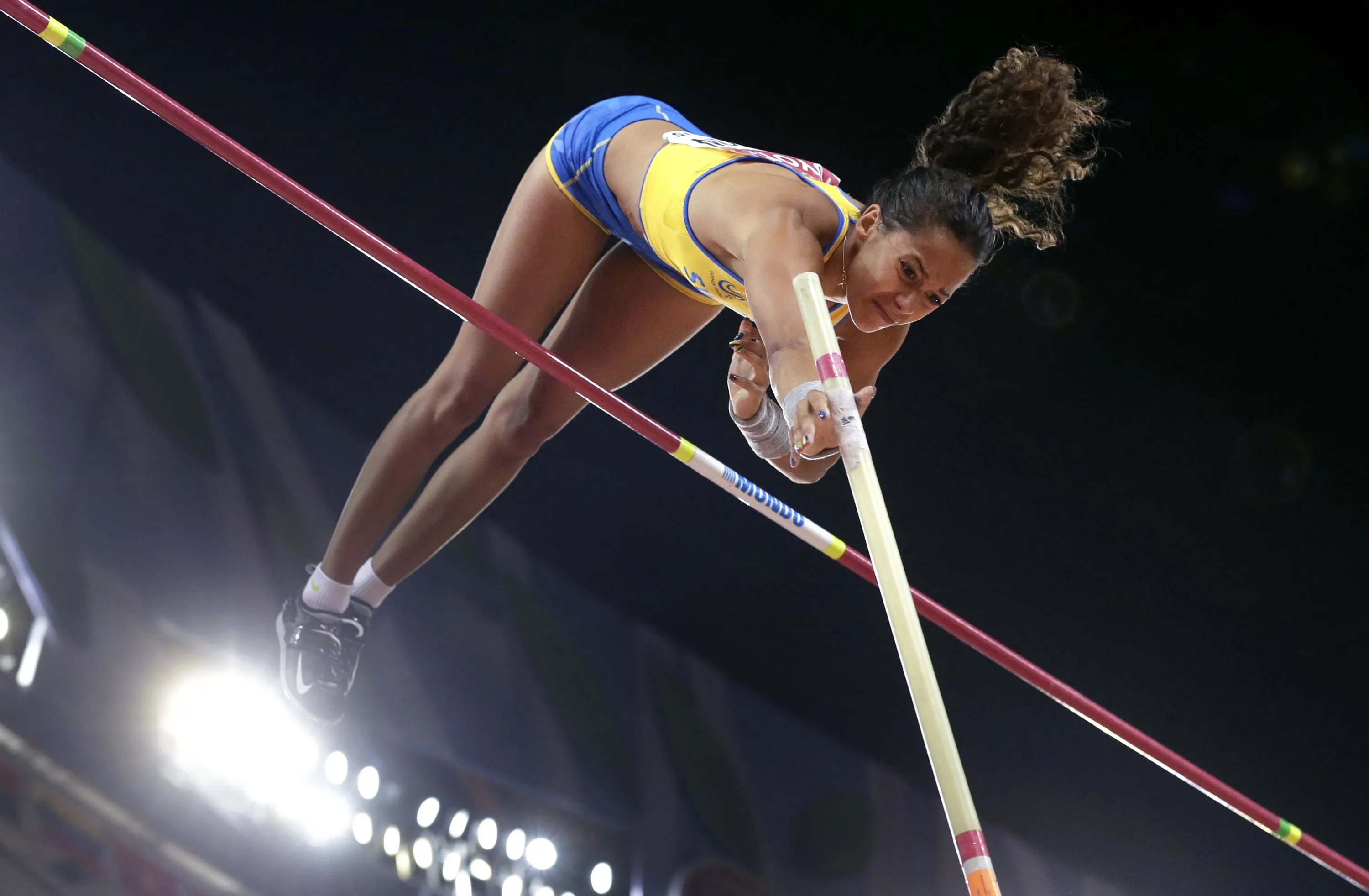 Sweden's Angelica Bengtsson clears the bar during the women's pol...
