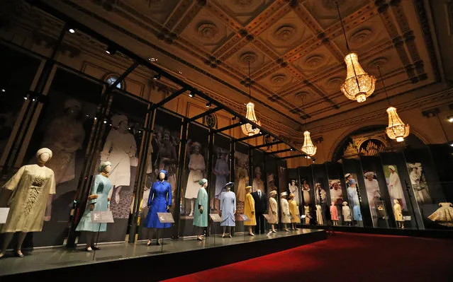 Dresses of Britain's Queen  Elizabeth are on display at an exhibition at Buckingham Palace in London, Thursday, July 21, 2016. (Photo by Frank Augstein/AP Photo)