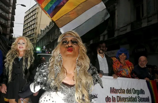 Revellers take part in a Gay Pride parade in Valparaiso,  Chile September 5, 2015. The banner reads, “Pride parade of the sexual diversity”. (Photo by Rodrigo Garrido/Reuters)