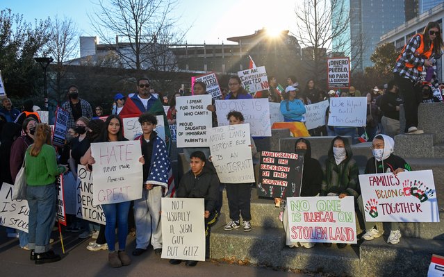 Hundreds of people carrying banners and flags, gather to protest against US President Trump's immigration policies and march for freedom to defend immigrant families in Charlotte North Carolina, United States on February 1, 2025. (Photo by Peter Zay/Anadolu via Getty Images)