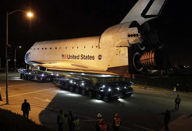 The space shuttle Endeavour leaves Los Angeles International Airport onto the streets of the Westchester neighborhood in the early hours of  in Los Angeles, California. The space shuttle will make a two-day trek across Los Angeles and Inglewood to the California Science Center, where it will be on permanent display.  (Photo by Lawrence K. Ho)