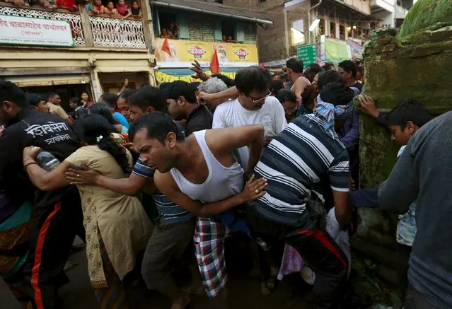 Devotees try to get past a security barricade during the second “Shahi Snan” (grand bath) at “Kumbh Mela”, or Pitcher Festival, in Trimbakeshwar, India, September 13, 2015. (Photo by Danish Siddiqui/Reuters)