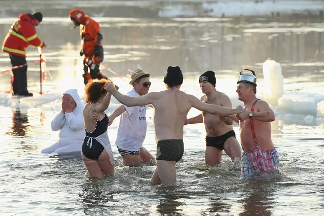Ice swimming enthusiasts take to the frigid waters of Orankesee lake during the 27th annual “Winter Swimming in Berlin” on January 8, 2011 in Berlin, Germany. (Photo by Sean Gallup/Getty Images)