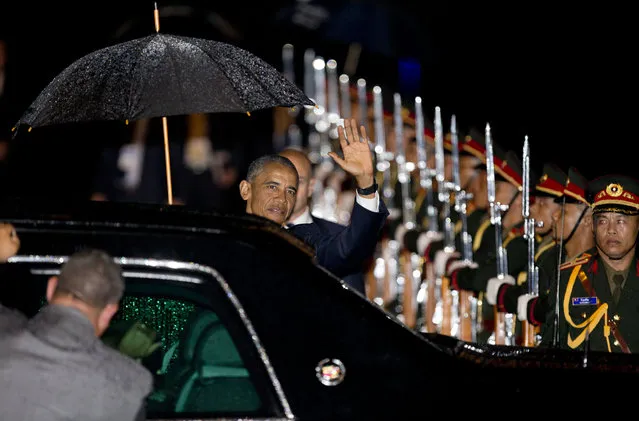 U.S. President Barack Obama waves upon his arrival at Wattay International Airport in Vientiane, Laos, Monday, September 5, 2016. Obama will be meeting the leaders of the Association of Southern Asian Nations (ASEAN) at a summit aimed at strengthening the U.S.– ASEAN strategic partnership. (Photo by Gemunu Amarasinghe/AP Photo)