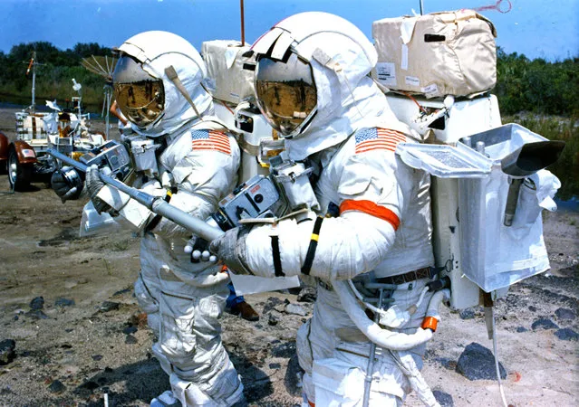 Astronauts Harrison Schmitt (left) and Eugene Andrew Cernan practice taking geological samples at the Kennedy Space Center in Florida, in preparation for NASA's scheduled Apollo 17 lunar landing mission, on August 28, 1972. Schmitt is the Lunar Module Pilot and Cernan is the mission's Commander. They are training for their period of EVA (extravehicular activity) on the Moon. (Photo by Space Frontiers/Getty Images)