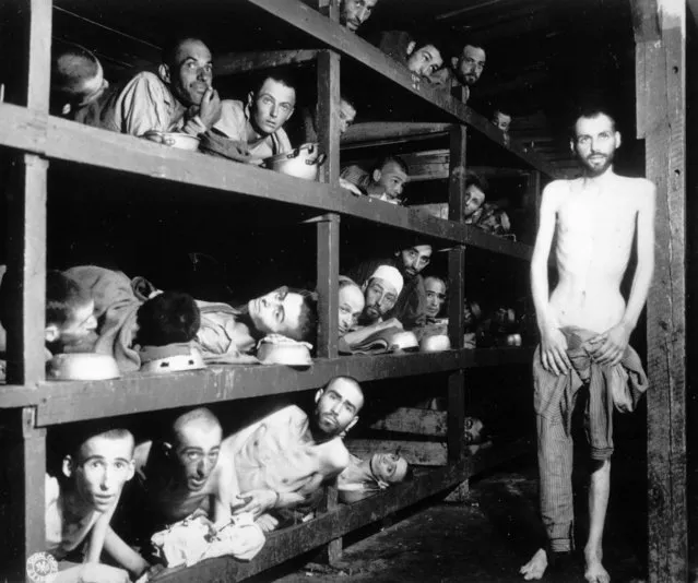 This April 16, 1945 file photo provided by the U.S. Army, shows inmates of the German KZ Buchenwald inside their barrack, a few days after U.S troops liberated this concentration camp near Weimar. The young man seventh from left in the middle row bunk is Elie Wiesel, who would later become an author and Nobel Peace Prize laureate. (Photo by U.S. Army via AP Photo)