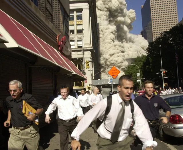 In this Tuesday, September 11, 2001 file phtoo, people run away from a collapsing World Trade Center tower in New York. Al-Qaida's 9/11 attacks against the U.S. killed almost 3,000 people. (Photo by Suzanne Plunkett/AP Photo)