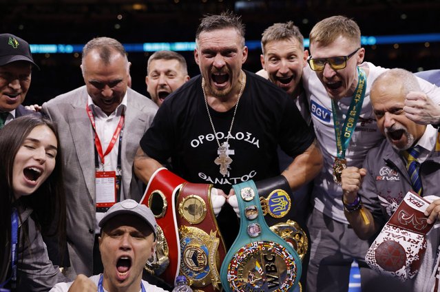 Oleksandr Usyk celebrates winning their IBF, IBO, WBC and WBO World heavyweight bout against Daniel Dubois at Wembley Stadium in London on Saturday, July 19, 2025. (Photo by Andrew Couldridge/Action Images via Reuters)