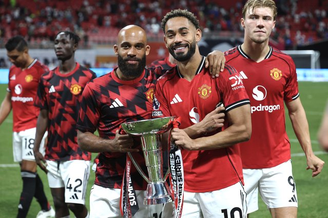Bryan Mbeumo and Matheus Cunha of Manchester United celebrate winning the Summer Series league after the Premier League Summer Series match between Manchester United and Everton FC at Mercedes-Benz Stadium on August 03, 2025 in Atlanta, Georgia. (Photo by Kevin C. Cox – Premier League/Getty Images)