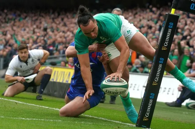 Ireland's James Lowe (right) tackled by France's Damian Penaud on the way to scoring their side's second try of the game during the Guinness Six Nations match at the Aviva Stadium in Dublin, Ireland on Saturday, February 11, 2023. (Photo by Brian Lawless/PA Images via Getty Images)