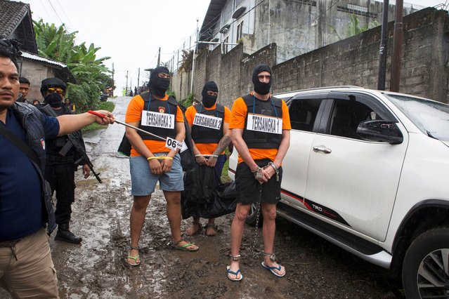 From left, Australian nationals identified by their initials as MC, PT, and DJF, the suspects in the fatal shooting of an Australian tourist in June, take part in a police reenactment in Badung, Bali, Indonesia on Wednesday, July 30, 2025. (Photo by Firdia Lisnawati/AP Photo)