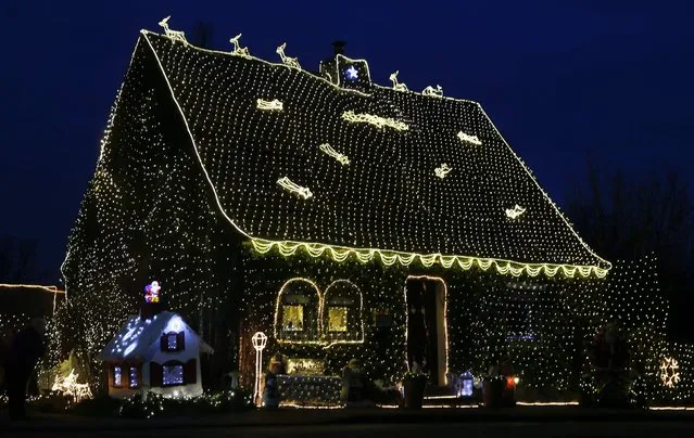 A house in the town of Stolberg near the western German city of Aachen is decorated for Christmas with some 200,000 LED lights December 16, 2014. (Photo by Wolfgang Rattay/Reuters)