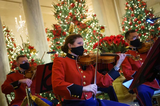 A military band plays Christmas music in the Grand Foyer of the White House on November 30, 2020 in Washington, DC. This year's theme for the White House Christmas decorations is “America the Beautiful”. (Photo by Drew Angerer/Getty Images)