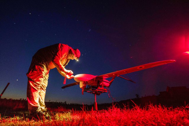 A Ukrainian National Guard serviceman of 3rd brigade, Spartan, prepares a Penguin UAV for flight near the frontline in Pokrovsk direction, Ukraine, Wednesday, August 6, 2025. (Photo by Evgeniy Maloletka/AP Photo)