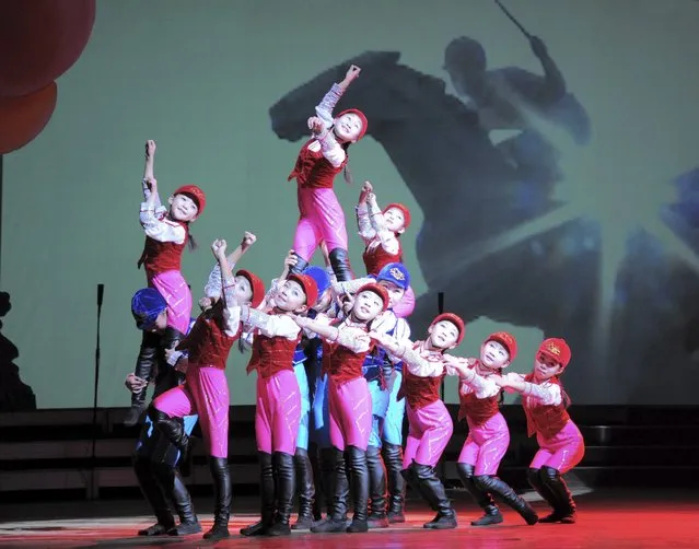 Schoolchildren's New Year performance “We Are the Happiest in the World” is given at the Central Youth Hall on the occasion of the New Year, December 31, in this photo released by North Korea's Korean Central News Agency (KCNA) in Pyongyang December 31, 2014. (Photo by Reuters/KCNA)