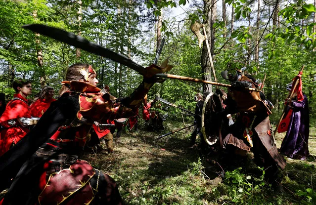 People dressed as characters from the computer game “World of Warcraft” fight during a battle near the town of Kamyk nad Vltavou, Czech Republic, April 28, 2018. (Photo by David W. Cerny/Reuters)