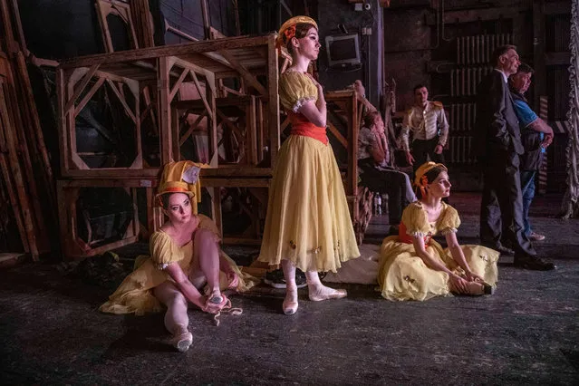 Dancers from Kyiv and Dnipro preparing themselves in the wings for a performance at the Kyiv National Opera House on June 24, 2022. (Photo by Julian Simmonds/The Guardian)