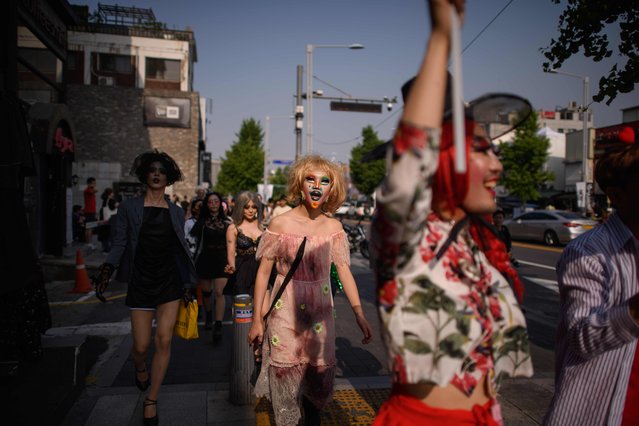 In a photo taken on May 26, 2018 participants of the “Seoul Drag Parade” march in the Itaewon district of Seoul. South Korea held its first ever drag parade this weekend, a small but significant step for rights activists in a country that remains deeply conservative when it comes to gender and sexuality. (Photo by Ed Jones/AFP Photo)