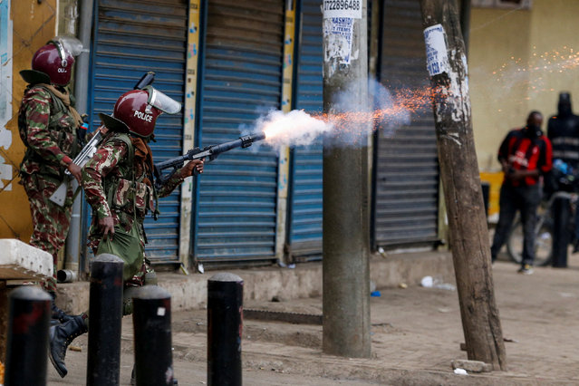 A police officer fires tear gas towards pro-reform protesters during an anti-government demonstration over what organisers say are tax hikes, bad governance, constitutional violations, extra-judicial killings and cost of living, in Nairobi, Kenya, on August 8, 2024. (Photo by Thomas Mukoya/Reuters)