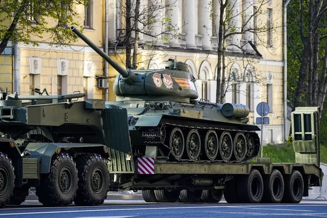 A Soviet era T-34 tank is transported toward Red Square to attend a dress rehearsal for the Victory Day military parade in Moscow, Russia, Sunday, May 7, 2023. The parade will take place at Moscow's Red Square on May 9 to celebrate 78 years of the victory in WWII. (Photo by AP Photo/Stringer)