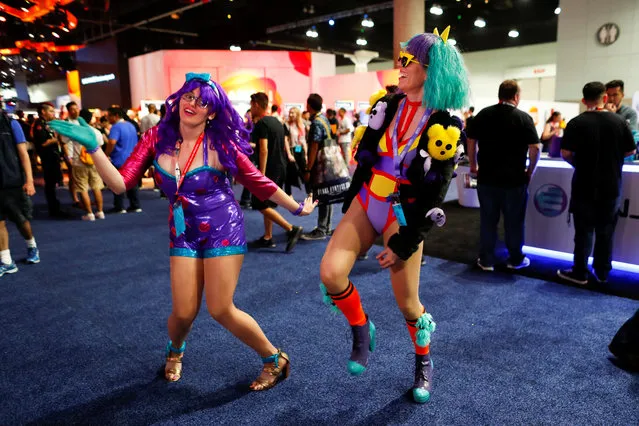 Attendees Rosalia Rohwer and Jennifer Salenger dress up as characters from the game “Just Dance” at E3, the world's largest video game industry convention in Los Angeles, California on June 12, 2018. (Photo by Mike Blake/Reuters)