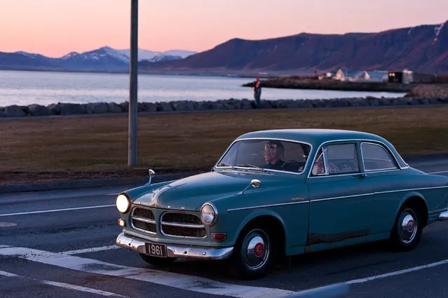 “Twilight on the road”. The sun has gone down the horizon. I was going to leave the bay road when I saw this old volvo waiting for the green light. The car, the lady and the twilight, It's a beautiful silent moment. Location: Reykjavik, Iceland. (Photo and caption by Weixin Shen/National Geographic Traveler Photo Contest)
