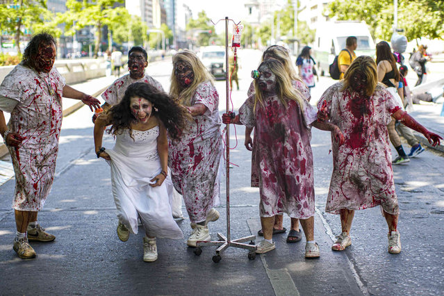 Revelers attend the annual zombie parade in Santiago Chile, Sunday, October 20, 2024. (Photo by Esteban Felix/AP Photo)