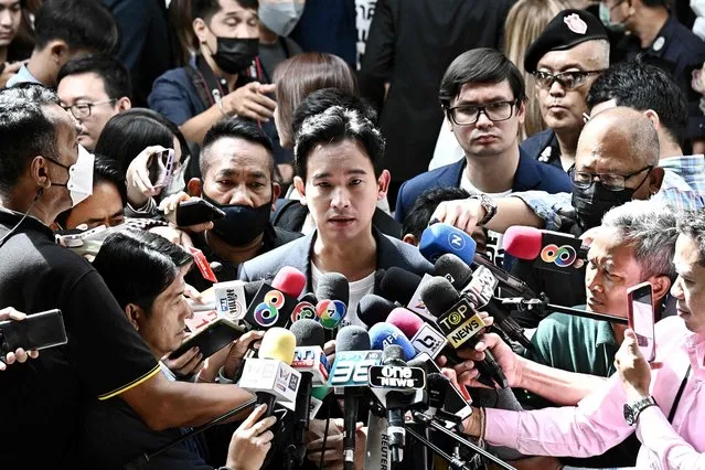 Move Forward Party leader and prime ministerial candidate Pita Limjaroenrat (C) talks to mediapersons after accompanying his party's newly elected House of Representatives members to report to the Parliament in Bangkok on June 27, 2023. (Photo by Lillian Suwanrumpha/AFP Photo)