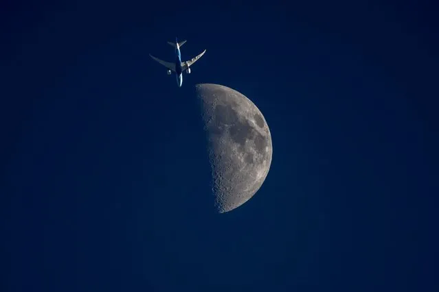 Xiamen Airlines' Boeing 787 aircraft flies as the moon illuminates the night sky on June 26, 2023 in Wuhan, Hubei Province of China. (Photo by VCG/VCG via Getty Images)