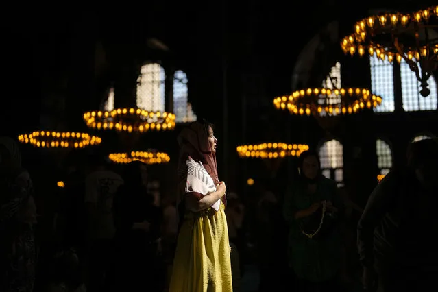 A woman stands at Byzantine-era Hagia Sophia mosque during the first day of Eid al-Adha in Istanbul, Turkey, Wednesday, June 28, 2023. (Photo by Francisco Seco/AP Photo)