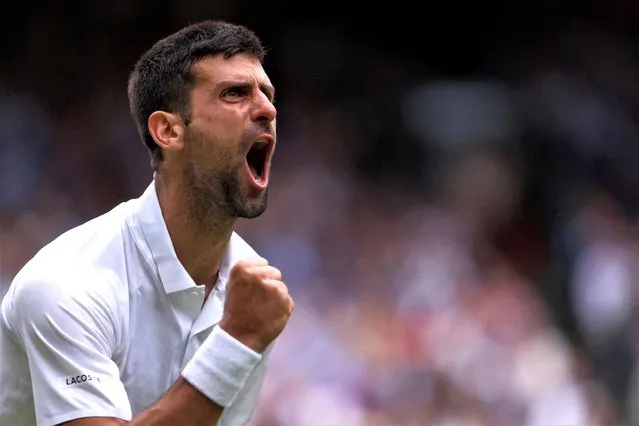 Novak Djokovic of Serbia celebrates after beating Andrey Rublev of Russia in the men's singles quarterfinals at the Wimbledon tennis tournament in London on July 11, 2023. (Photo by Andrew Couldridge/Reuters)