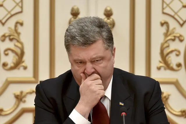 Ukraine's President Petro Poroshenko takes part in peace talks on resolving the Ukrainian crisis in Minsk, February 11, 2015. (Photo by Kirill Kudryavtsev/Reuters)