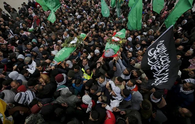 Mourners carry the bodies of Palestinians who allegedly carried out attacks against Israelis, after their bodies were released by Israel, during their funeral in Silwad near the West Bank city of Ramallah January 3, 2016. (Photo by Mohamad Torokman/Reuters)