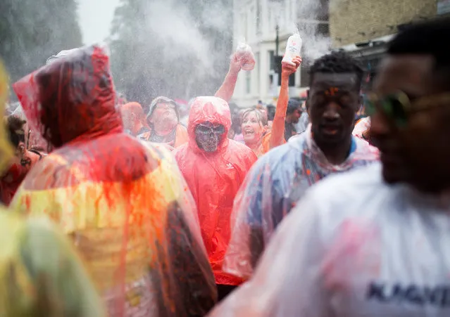 Revellers take part in the Notting Hill Carnival in London, Britain on August 26, 2018. The annual event on the streets of the Royal Borough of Kensington and Chelsea, over the August bank holiday weekend. It is led by members of the British West Indian community, and attracts around one million people annually, making it one of the world's largest street festivals. (Photo by Henry Nicholls/Reuters)