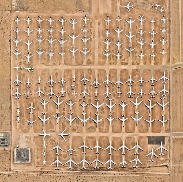 Aircraft boneyard 34°35′51′′N, 117°22′59′′W. The Southern California Logistics airport in Victorville contains an aircraft boneyard with more than 150 retired planes. Because the demand for jumbo jets has dropped significantly in the past two decades in favour of smaller, more affordable twin-engine planes, many large aircrafts have been retired. The dry conditions in Victorville, on the edge of the Mojave Desert, limits the corrosion of metal, meaning planes can be stored here for years while they are stripped for spare parts. (Photo by Daily Overview/DigitalGlobe, a Maxar Company)