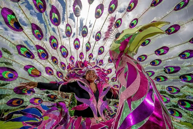 Members from the High Esteem Carnival Designs gather in Valley Gardens, United Kingdom on July 4, 2022 in preparation for the Harrogate Carnival to be held on the 30th July 2022. Created as a one-day spectacular, Carnival is a bustling hub of events staged on the last Saturday in July. (Photo by Charlotte Graham/CAG Photography Ltd)